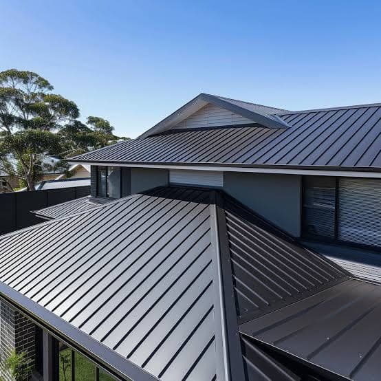 New dark Colorbond steel roof installation aerial view on modern Sydney home