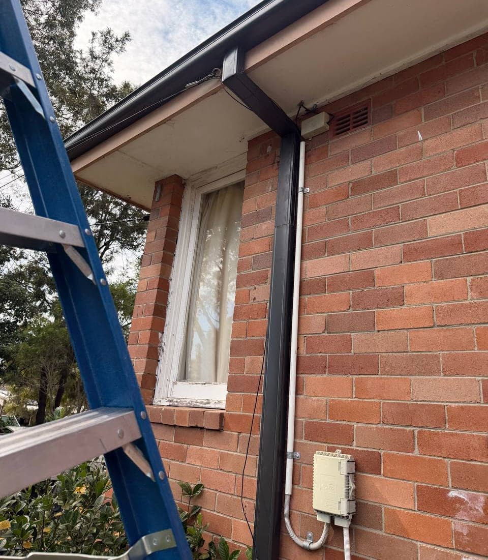 New Colorbond gutter and downpipe replacement Crown Roofers Sydney residential — photo 1 v2