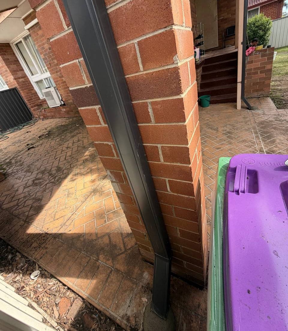 New Colorbond gutter and downpipe replacement before and after Crown Roofers Riverwood South West Sydney — after v2