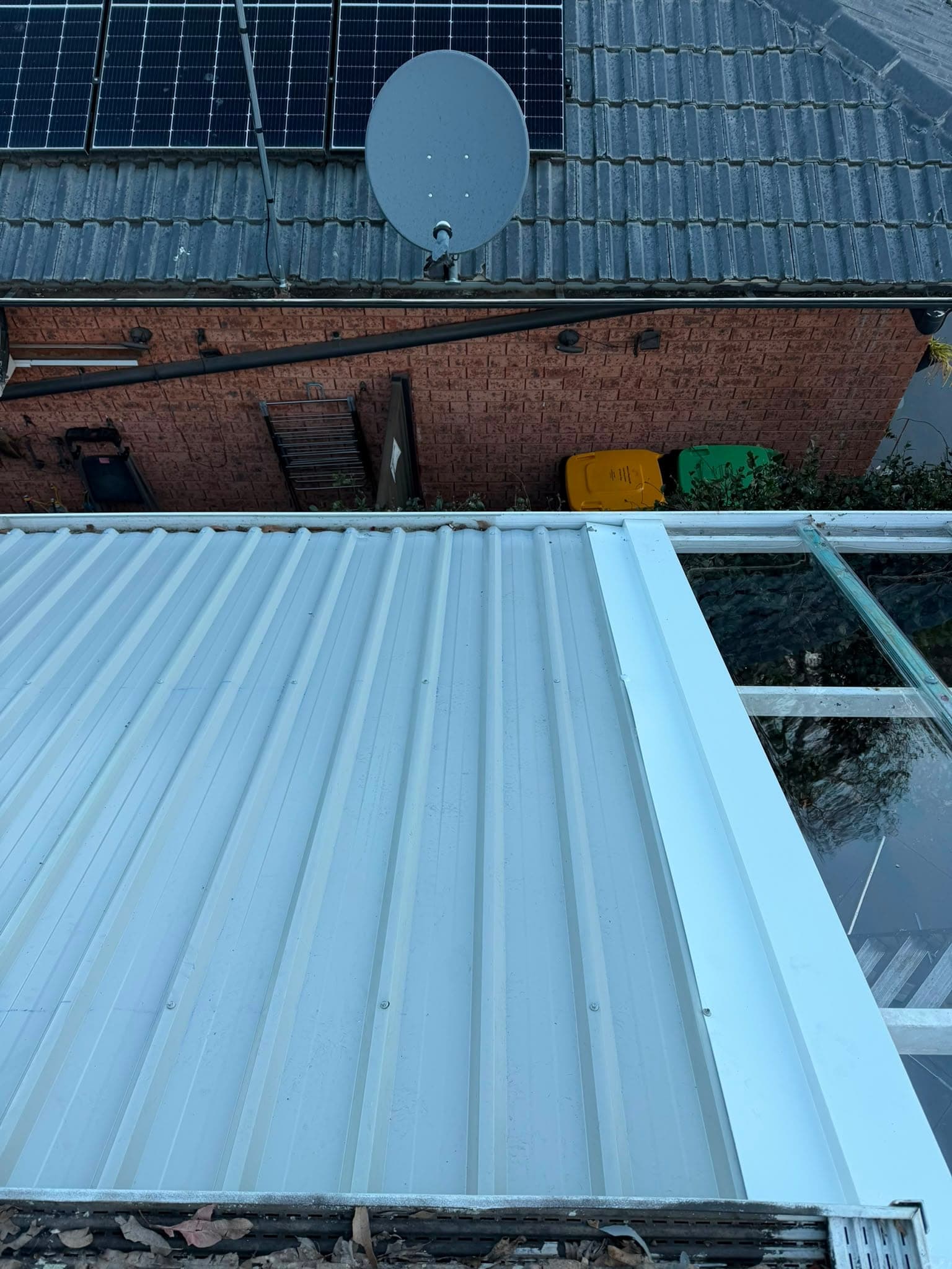 Colorbond and polycarbonate re-sheet Crown Roofers Emu Heights — new white Colorbond corrugated sheeting with fresh flashing