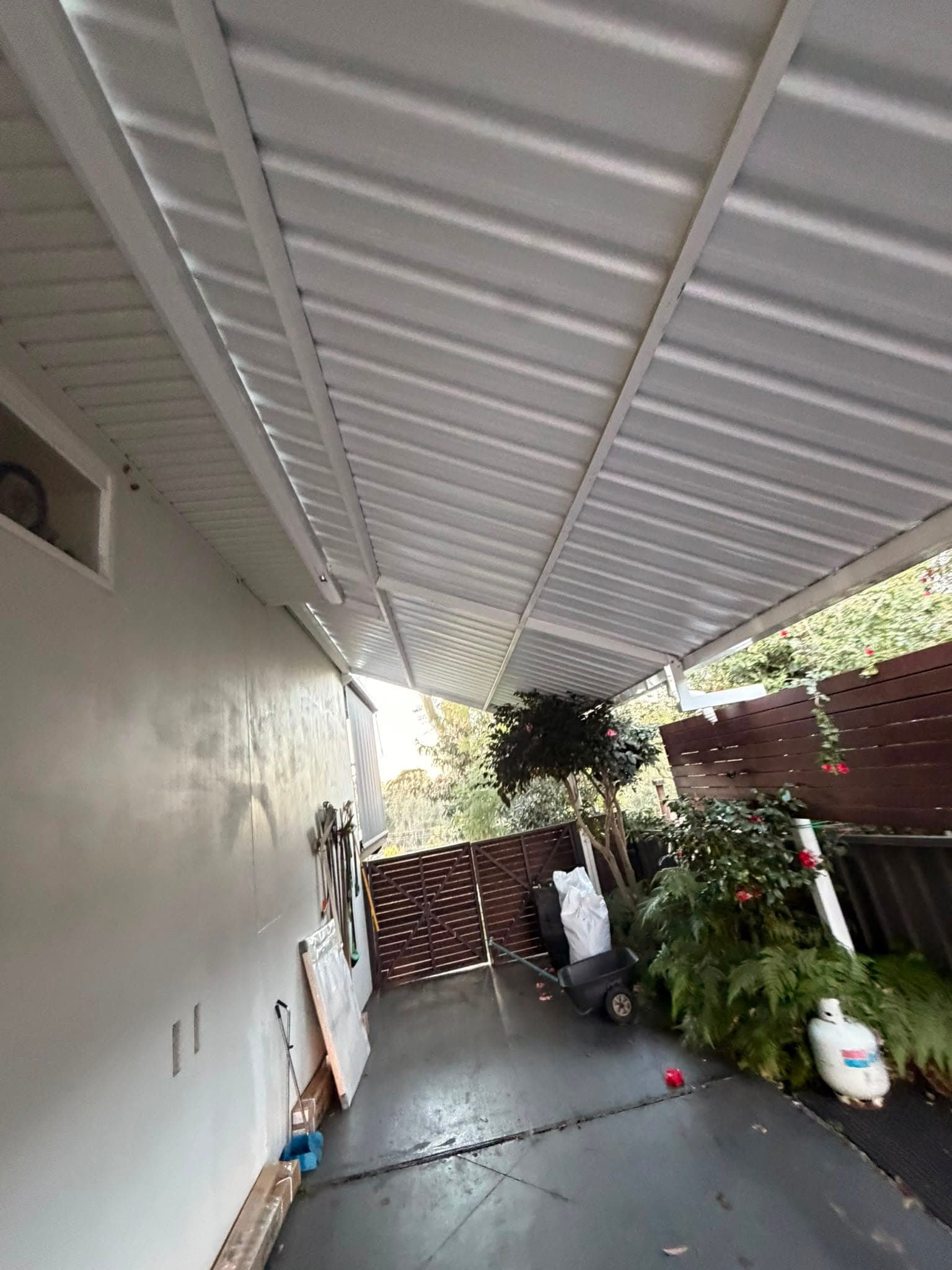 Colorbond and polycarbonate re-sheet Crown Roofers Emu Heights — new sheeting over the side walkway