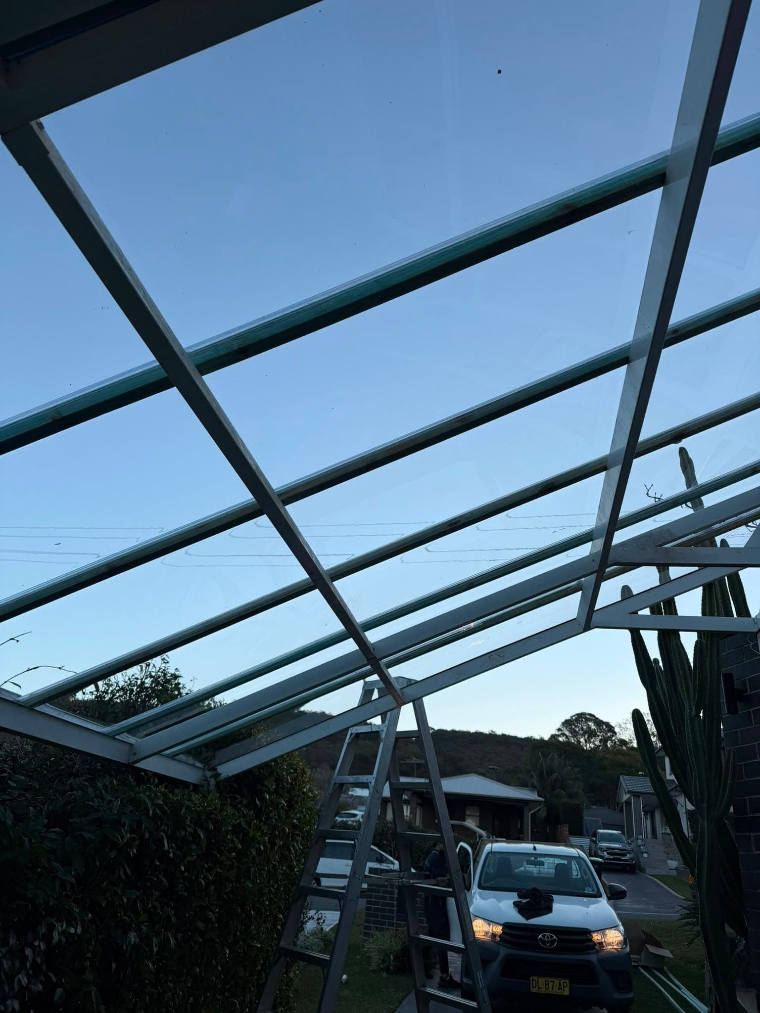 Colorbond and polycarbonate re-sheet Crown Roofers Emu Heights — polycarbonate sheets fixed to the existing frame