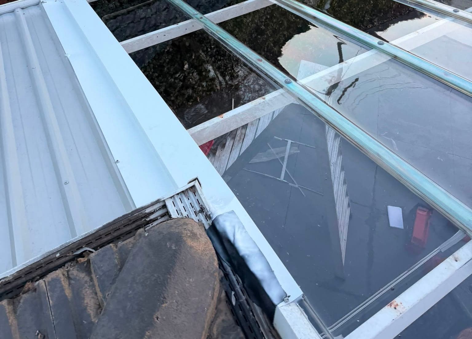 Colorbond and polycarbonate re-sheet Crown Roofers Emu Heights — finished polycarbonate and Colorbond sections from above