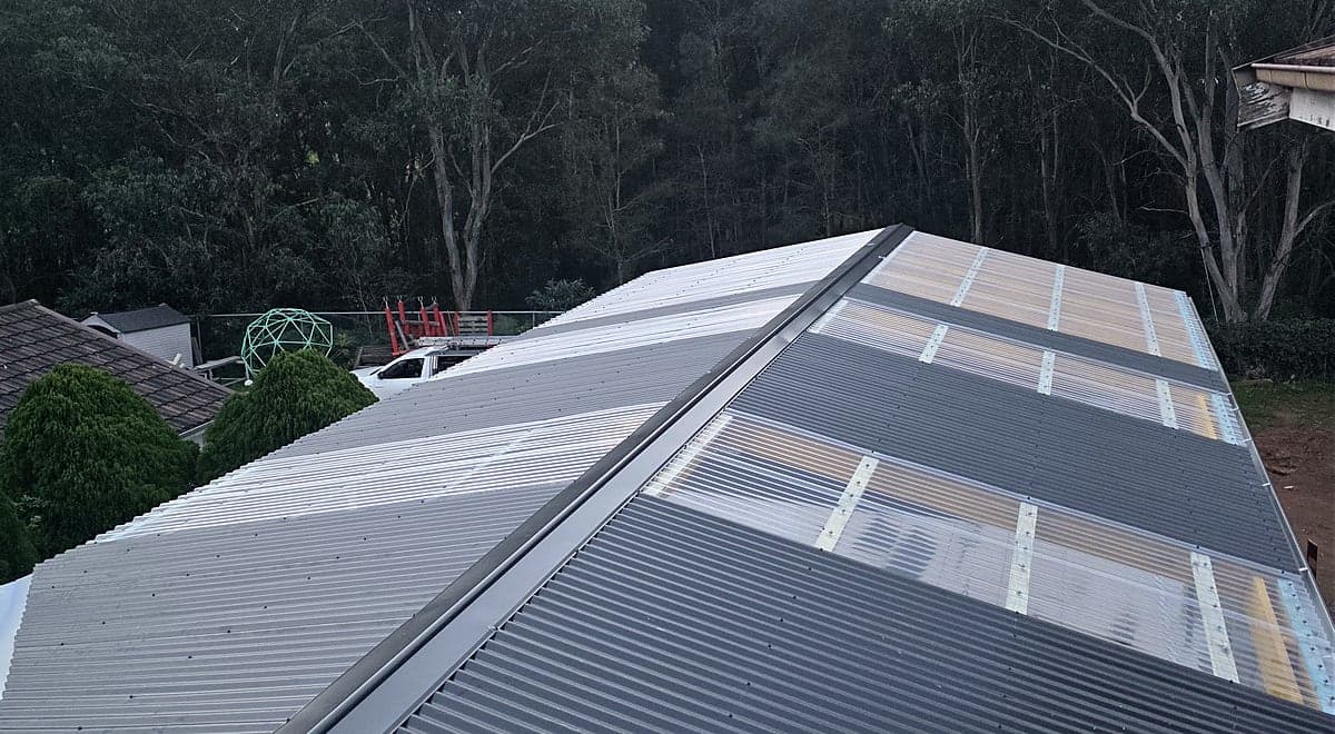 New Colorbond and polycarbonate roof sheeting installed by Crown Roofers, Sydney