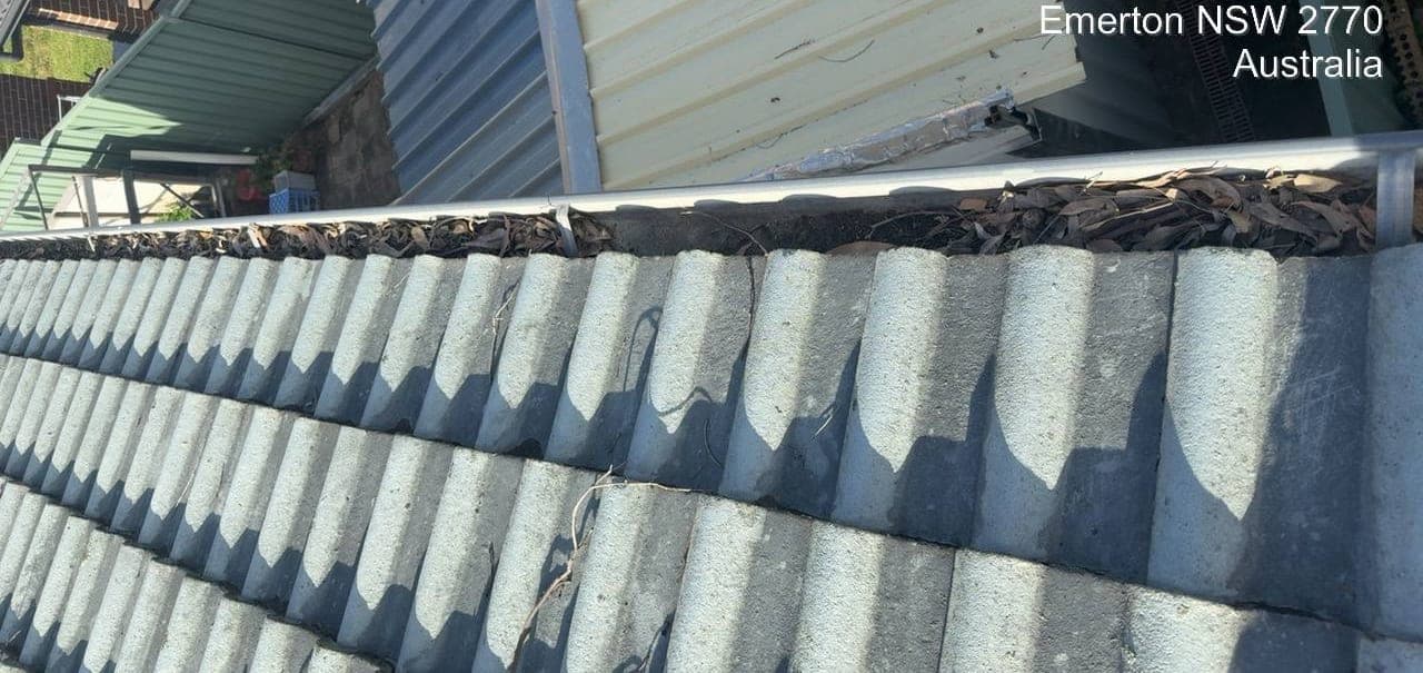 Residential gutter cleaning — Crown Roofers project Emerton Western Sydney — gutter clean — debris cleared from full perimeter