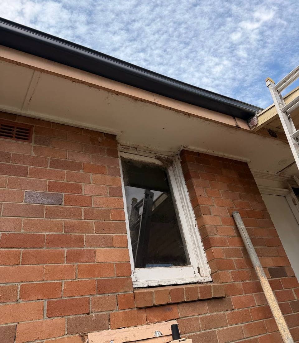 New Colorbond gutter and downpipe replacement before and after Crown Roofers Riverwood South West Sydney — before v2