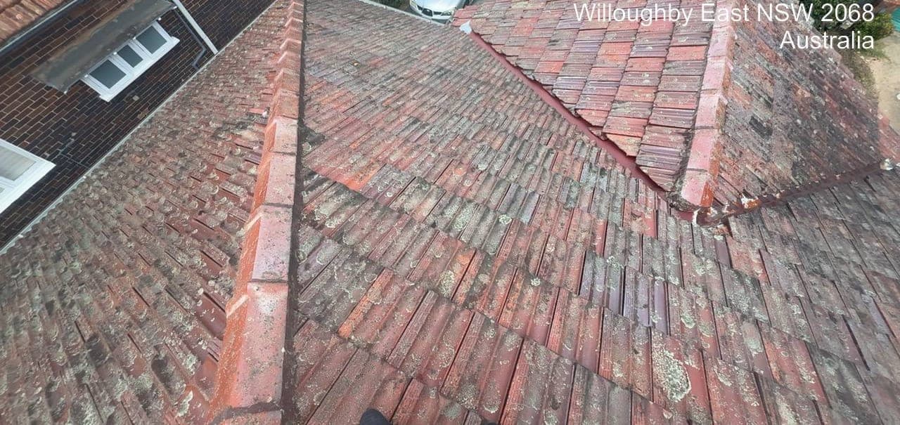 Heritage terracotta tile roof restoration — Crown Roofers project Willoughby East Lower North Shore Sydney — before restoration — close detail of cracked ridge pointing