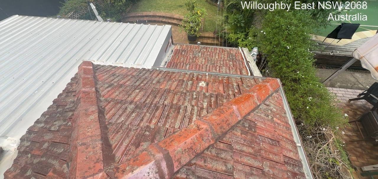 Heritage terracotta tile roof restoration — Crown Roofers project Willoughby East Lower North Shore Sydney — before restoration — failed bedding mortar visible at hip