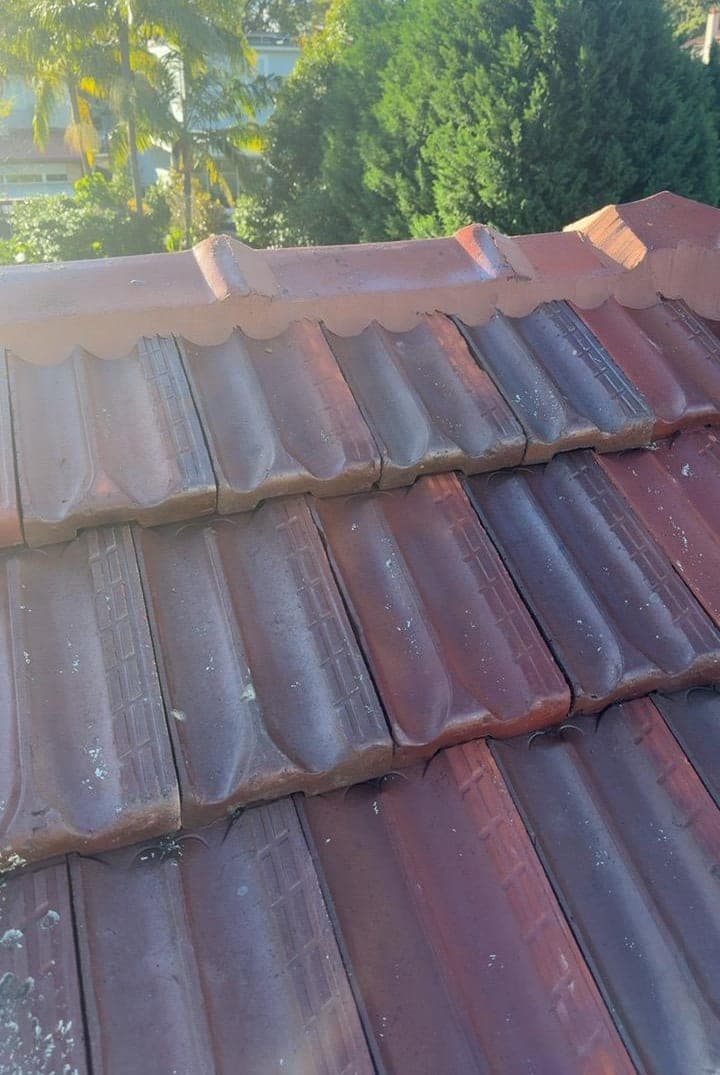 Heritage terracotta tile roof restoration — Crown Roofers project Willoughby East Lower North Shore Sydney — valley flashing closeup with new butyl seal