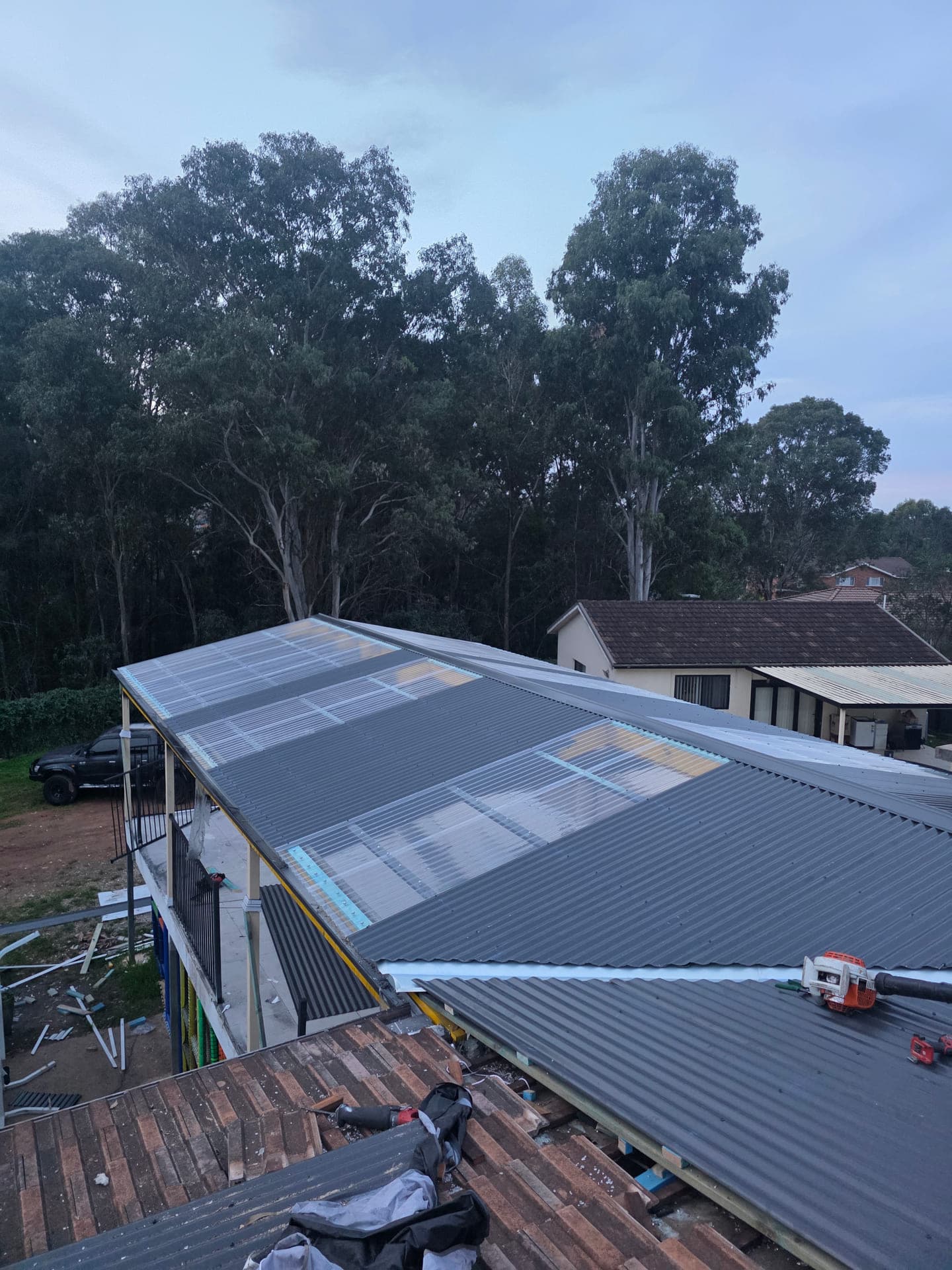 Corrugated metal roofing and translucent roof sheets installed on a Bonnyrigg home