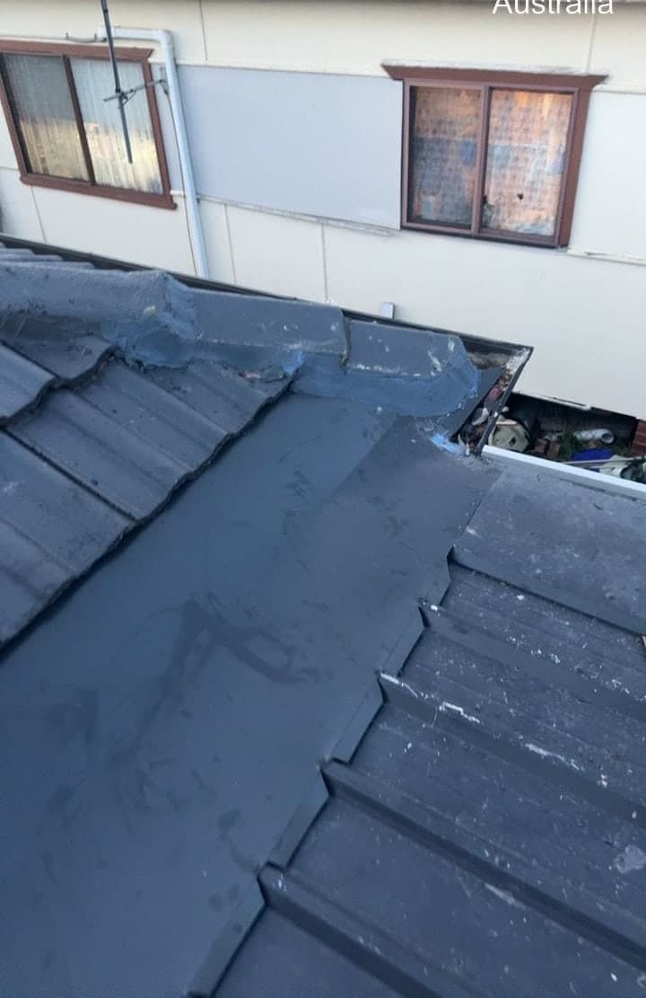 Concrete tile roof restoration with charcoal membrane Crown Roofers Blacktown Western Sydney — photo 8