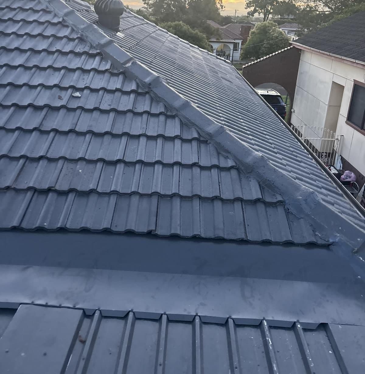 Concrete tile roof restoration with charcoal membrane Crown Roofers Blacktown Western Sydney — photo 1 v2