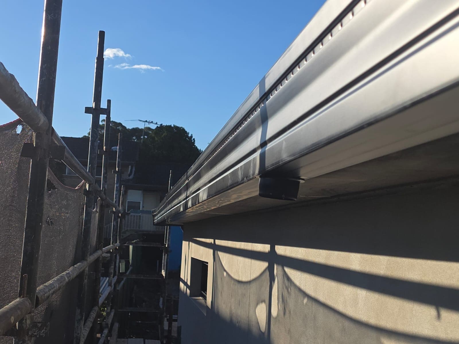 Tile roof restoration and new guttering Crown Roofers Kingsgrove — completed roof restoration and guttering at the end of the job