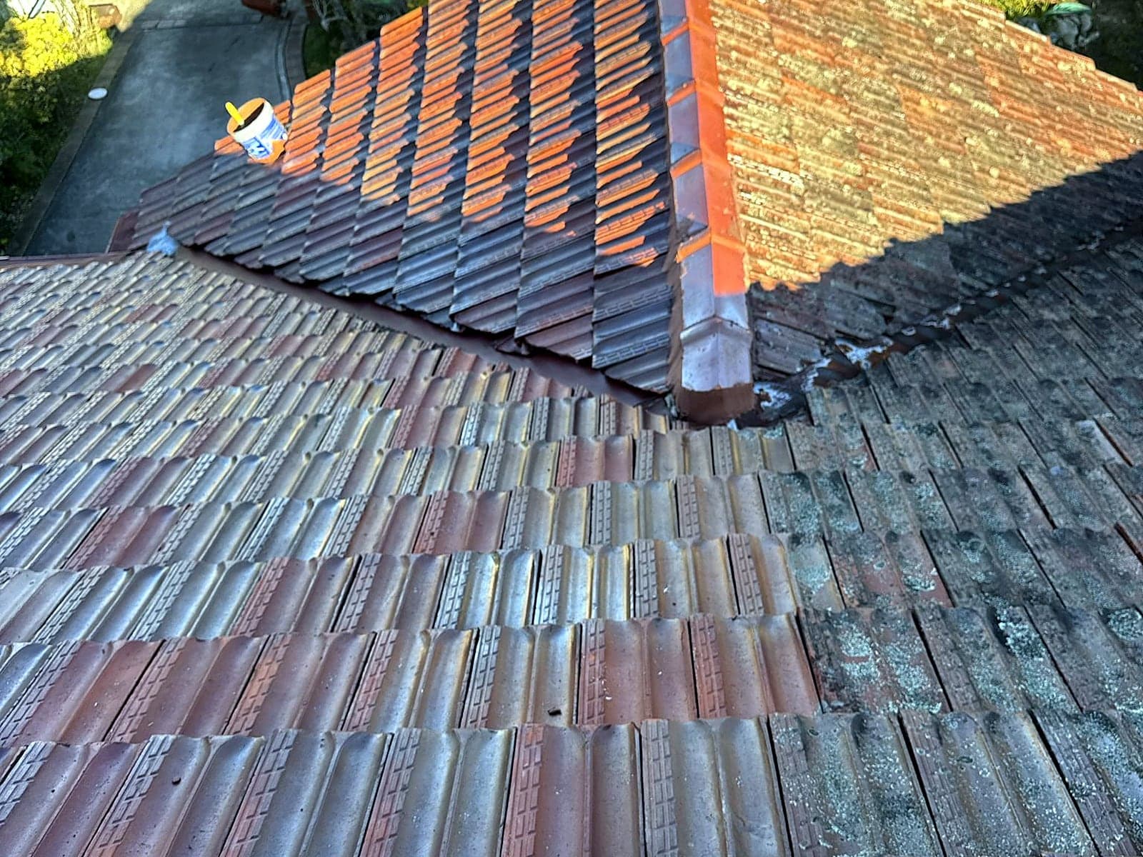 Tile roof before cleaning, showing moss and staining, Sydney